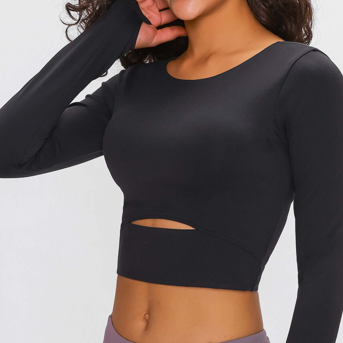 Comfortable activewear collection featuring a black long-sleeve top with a stylish cutout design.