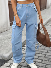 Front view of light blue high waist cargo jeans on model – Voguelle