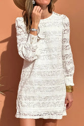Front view of Lace Long Sleeve Mini Dress in white on model – Voguelle