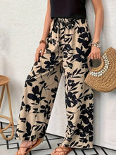 Front view high waist printed wide leg pants in Khaki with black floral print – Voguelle