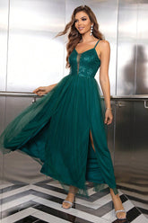 Front view of Model in green spaghetti strap slit maxi dress – Voguelle
