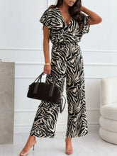 Front view of Animal Print Wide Leg Jumpsuit in black and white on model – Voguelle