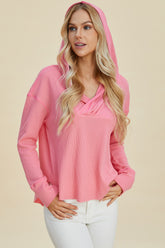 Pink casual hoodie with V-neck detail on model – Voguelle
