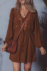 Front view of Floral Embroidered Long Sleeve Mini Dress in brown on model – Voguelle