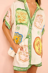 Front view of Chic Women’s Summer Set in white with green trim – Voguelle