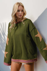 Lifestyle shot model in green star patched sweatshirt – Voguelle