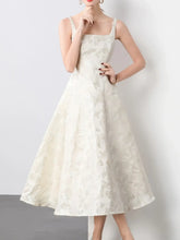 Front view of ivory embroidered A-line sleeveless midi dress on model – Voguelle