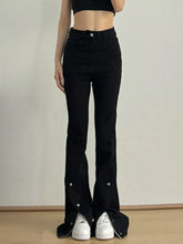 Front view of black high waist slit flare jeans on model – Voguelle