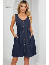 Front view of Sleeveless Button-Front Mini Dress with Pockets in navy on model – Voguelle