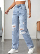 Front view of ripped straight leg high waist jeans in light blue – Voguelle