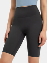 Front view of black high rise active shorts on model – Voguelle