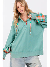 Front view of Oversized plaid contrast hoodie styled with light denim jeans – Voguelle