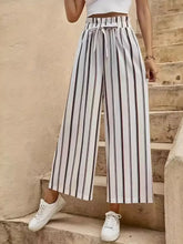 Front view of High waist striped wide leg pants with tie belt on model – Voguellee