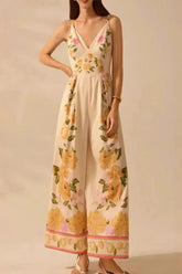 Front view of floral print wide-leg V-neck cami jumpsuit in beige on model – Voguelle