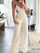 Front view of Cut-Out Wide Leg Jumpsuit in white on model – Voguelle