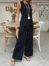 Front view of striped sleeveless two-piece set in black on model – Voguelle