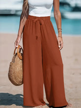 Rust wide leg pants front view on model – Voguelle