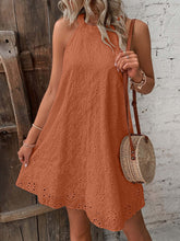 Front view of Sleeveless Eyelet Mini Dress in orange on model – Voguelle
