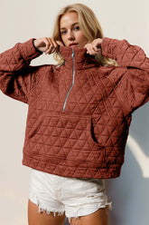 Front view of Rust quilted half zip sweatshirt with relaxed fit – Voguelle
