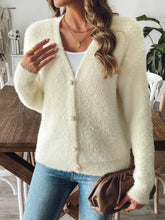 Front view of fuzzy button-front knit cardigan in white on model – Voguelle