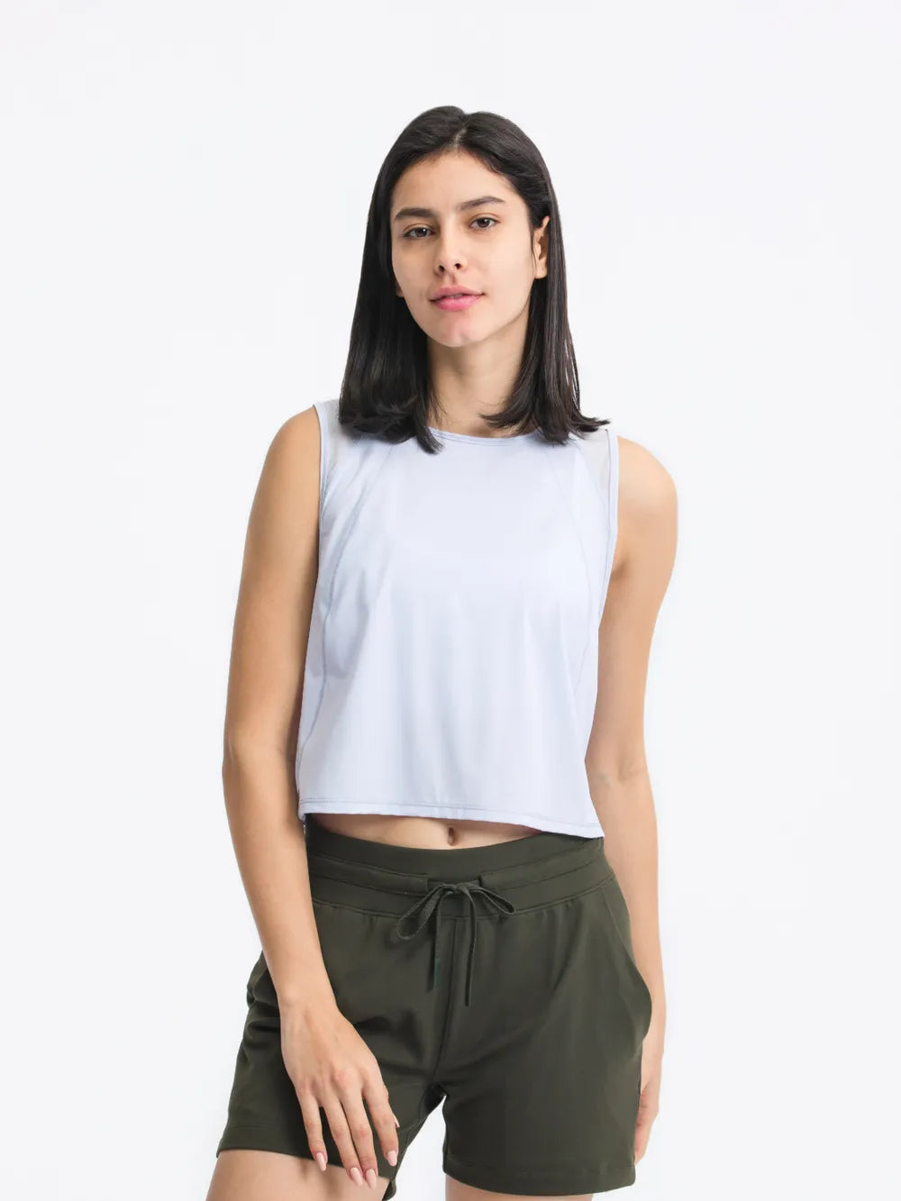 Front view of Millennia Cropped Active Tank in light yellow on model – Voguelle