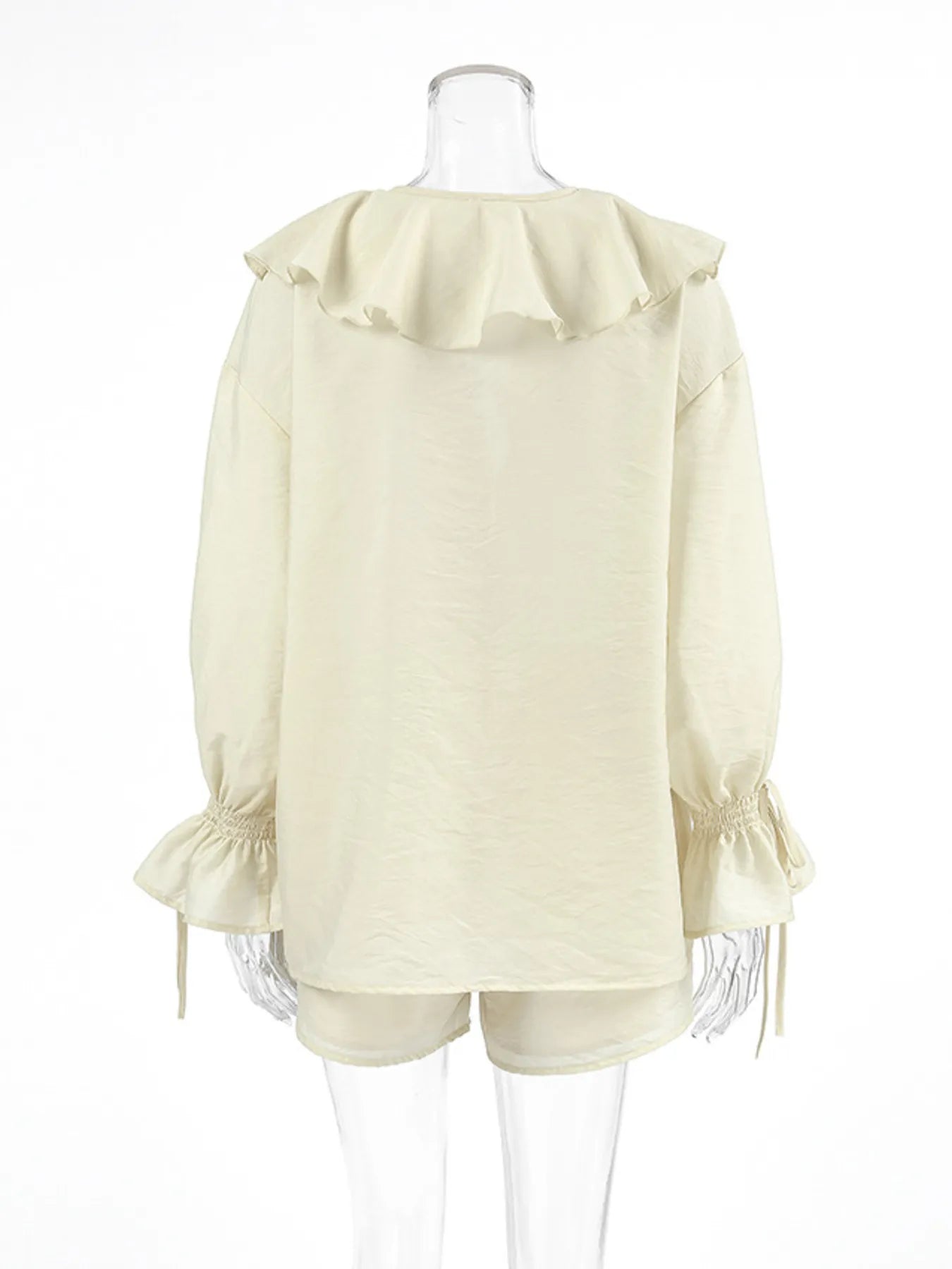Front detail of ruffle neckline on cream long sleeve blouse – Voguelle