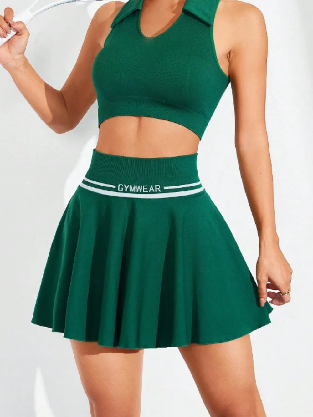 Front view of green ruched high waist mini active skirt on model styled for active sports lifestyle– Voguelle