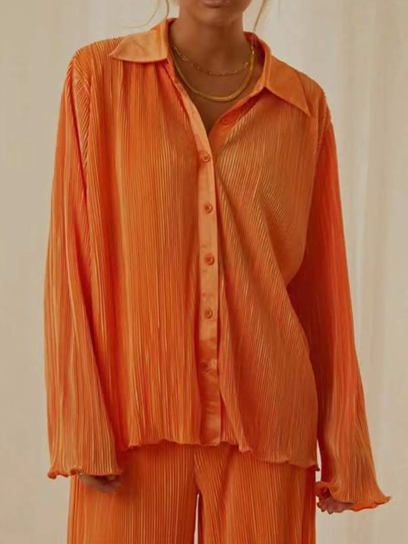 Long sleeve button-up orange shirt styled open with pants – Voguelle