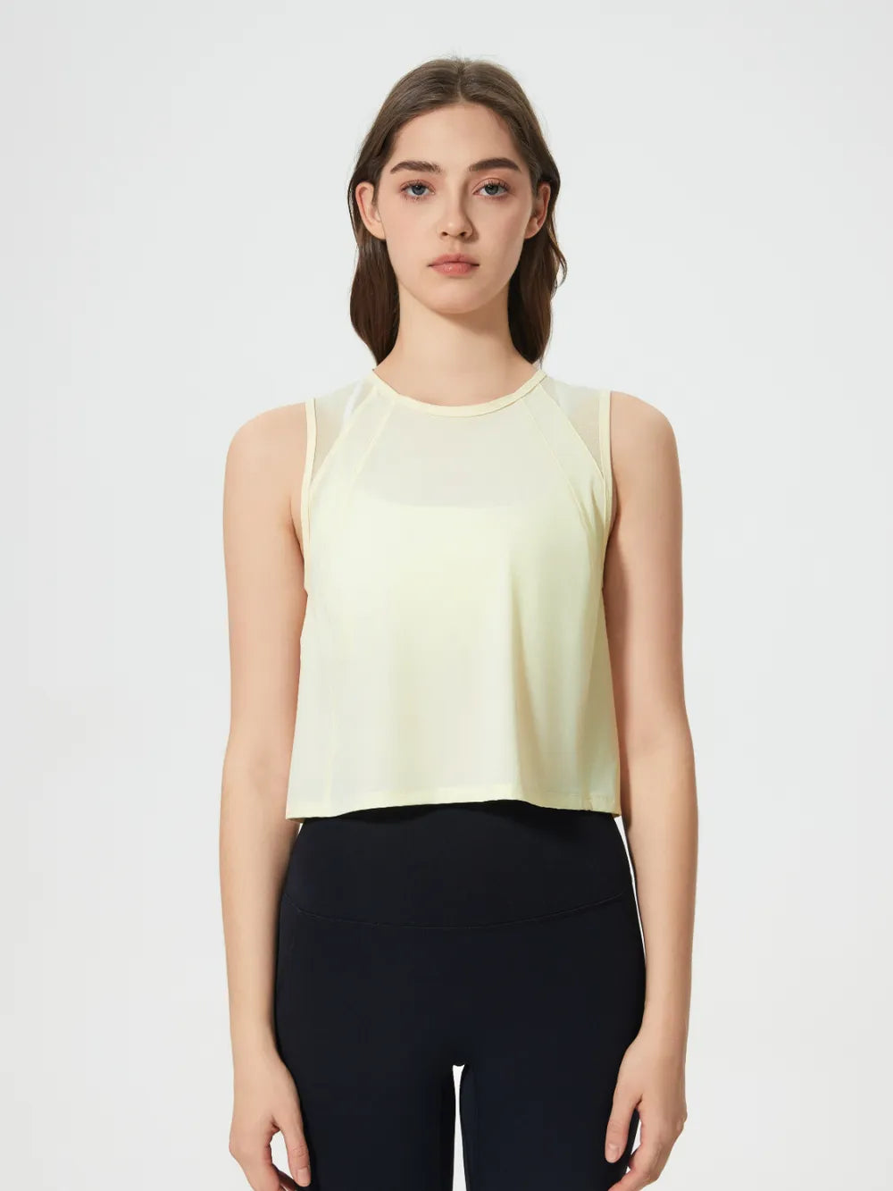 Model posing in Millennia Cropped Active Tank in gray – Voguelle