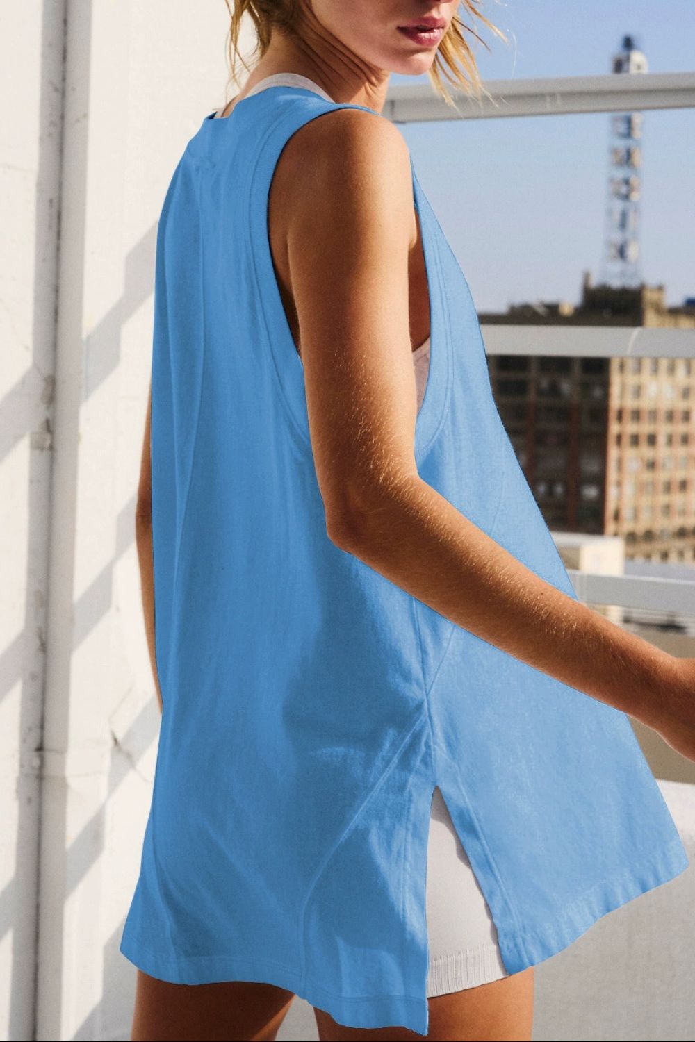 Back side of Blue V-neck slit hem tank with pocket detail – Voguelle