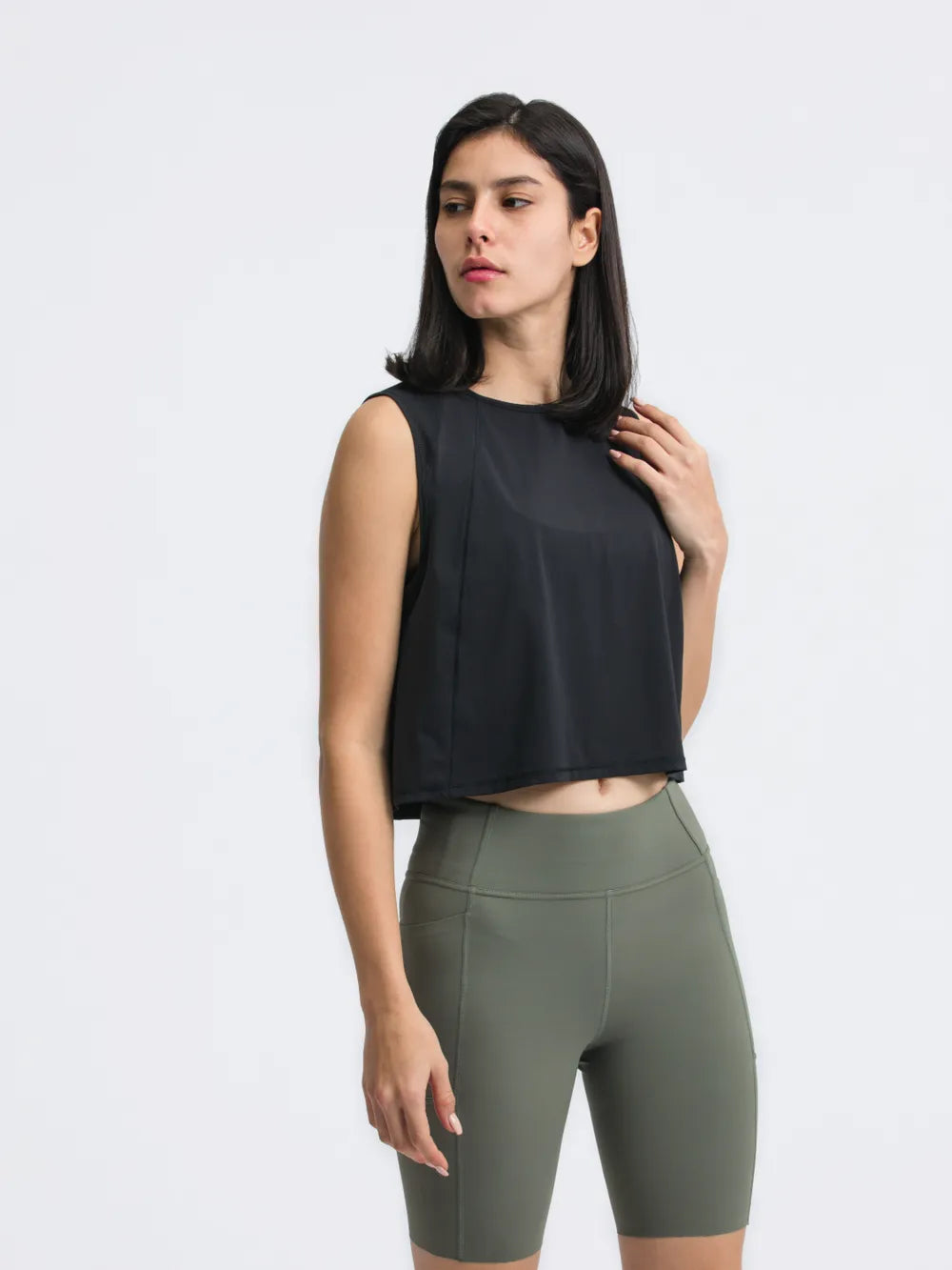 Front view of Millennia Cropped Active Tank in black on model – Voguelle