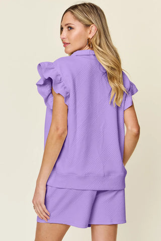 Front close-up of cream textured short set neckline – Voguelle