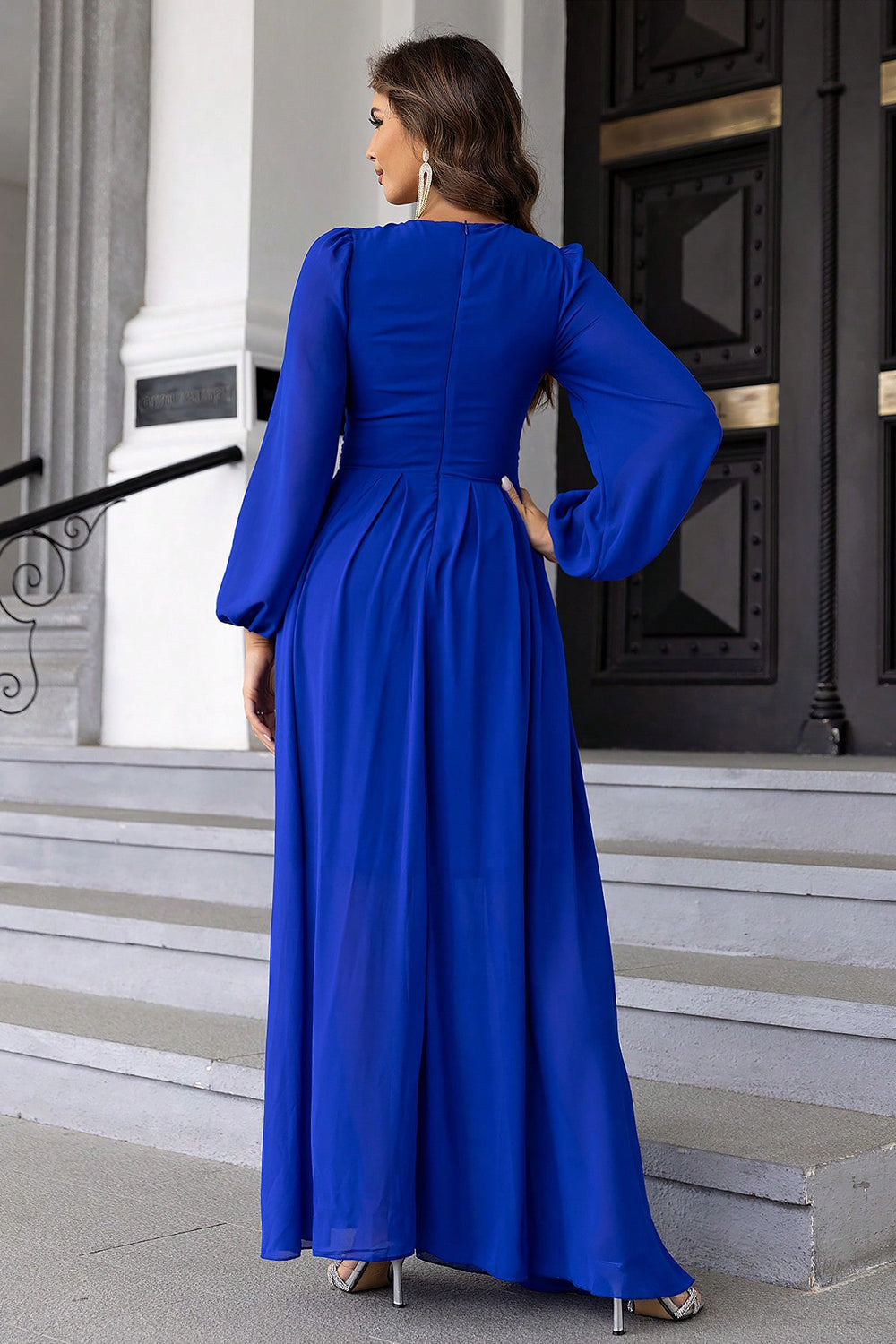 Side angle of long sleeve twist cutout royal blue gown – Voguelle