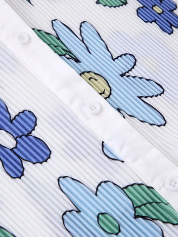 Pattern detail of colorful button-up shirt and wide-leg pants – Voguelle