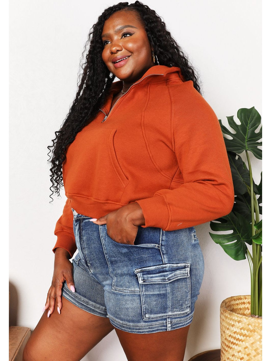 Front pose of model in rust cropped half-zip hoodie – Voguelle
