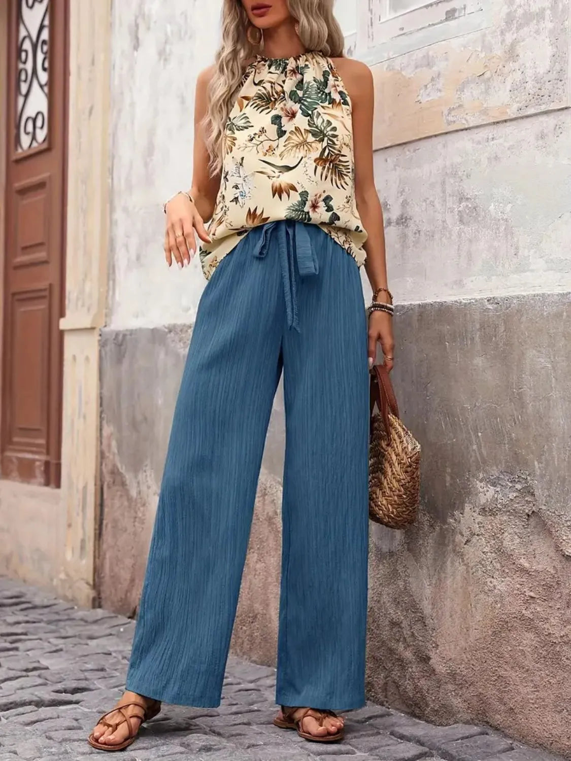 Printed floral blouse tucked into wide leg green pants – Voguelle