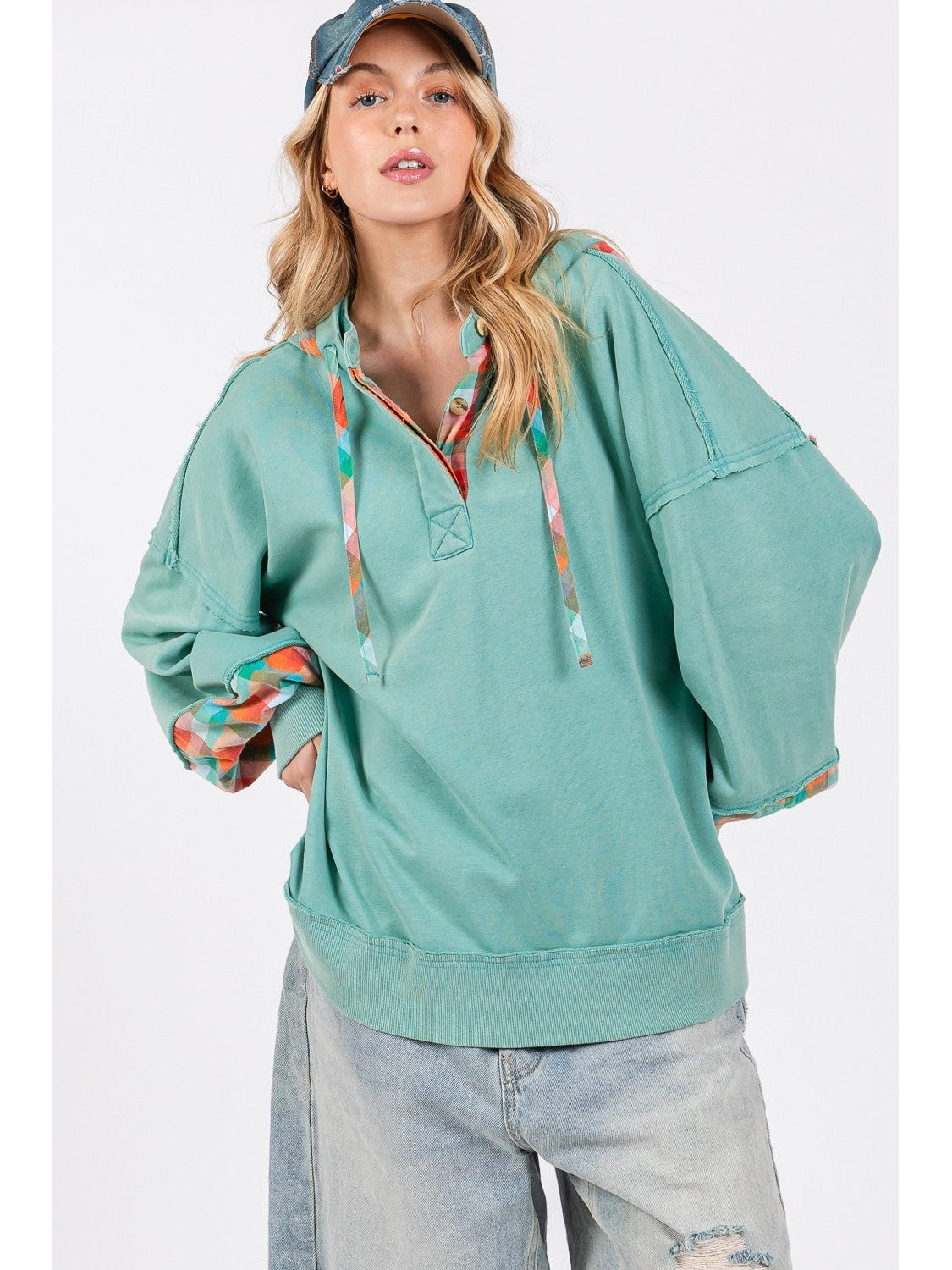 Model wearing relaxed fit washed hoodie with plaid print accents – Voguelle