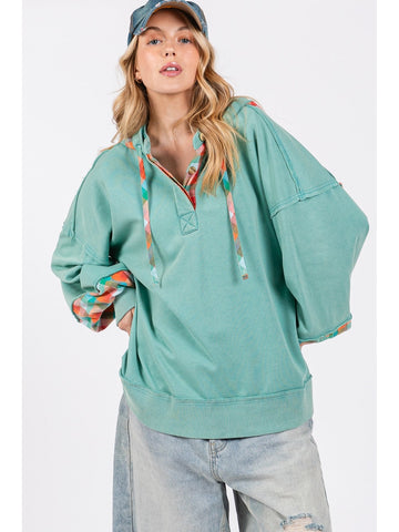 Model wearing relaxed fit washed hoodie with plaid print accents – Voguelle
