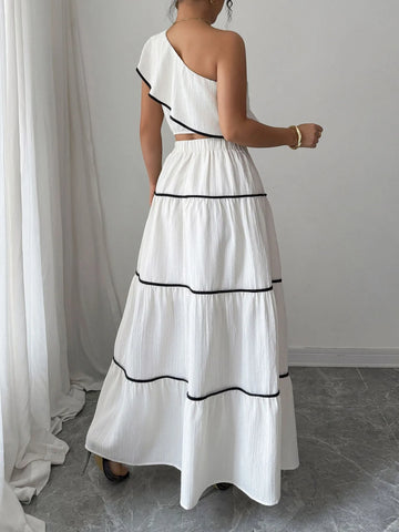 Back view of white one-shoulder ruffle top and maxi skirt set on model – Voguelle