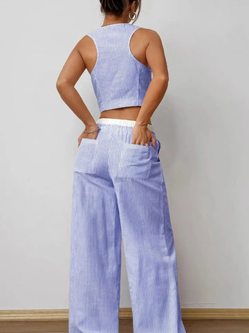 Close-up front detail striped vest and pants outfit – Voguelle