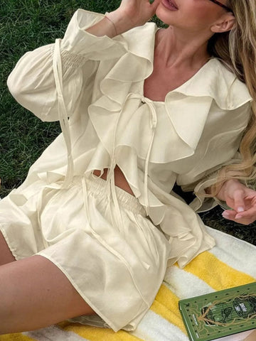 Model styling cream Ruffled V-Neck Long Sleeve Top outdoors – Voguelle