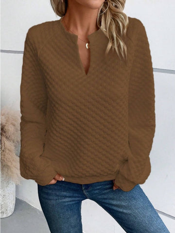 Model pairing notched sweatshirt with jeans – Voguelle