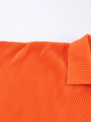 Model showcasing chic button-up shirt in orange set – Voguelle