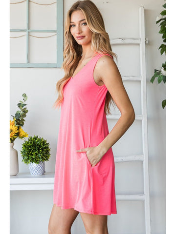 Model showing pocket detail on pink V-neck mini tank dress – Voguelle