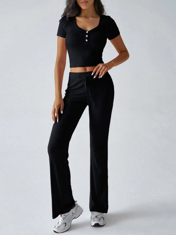 Pink ribbed crop top with button detail styled with pants – Voguelle
