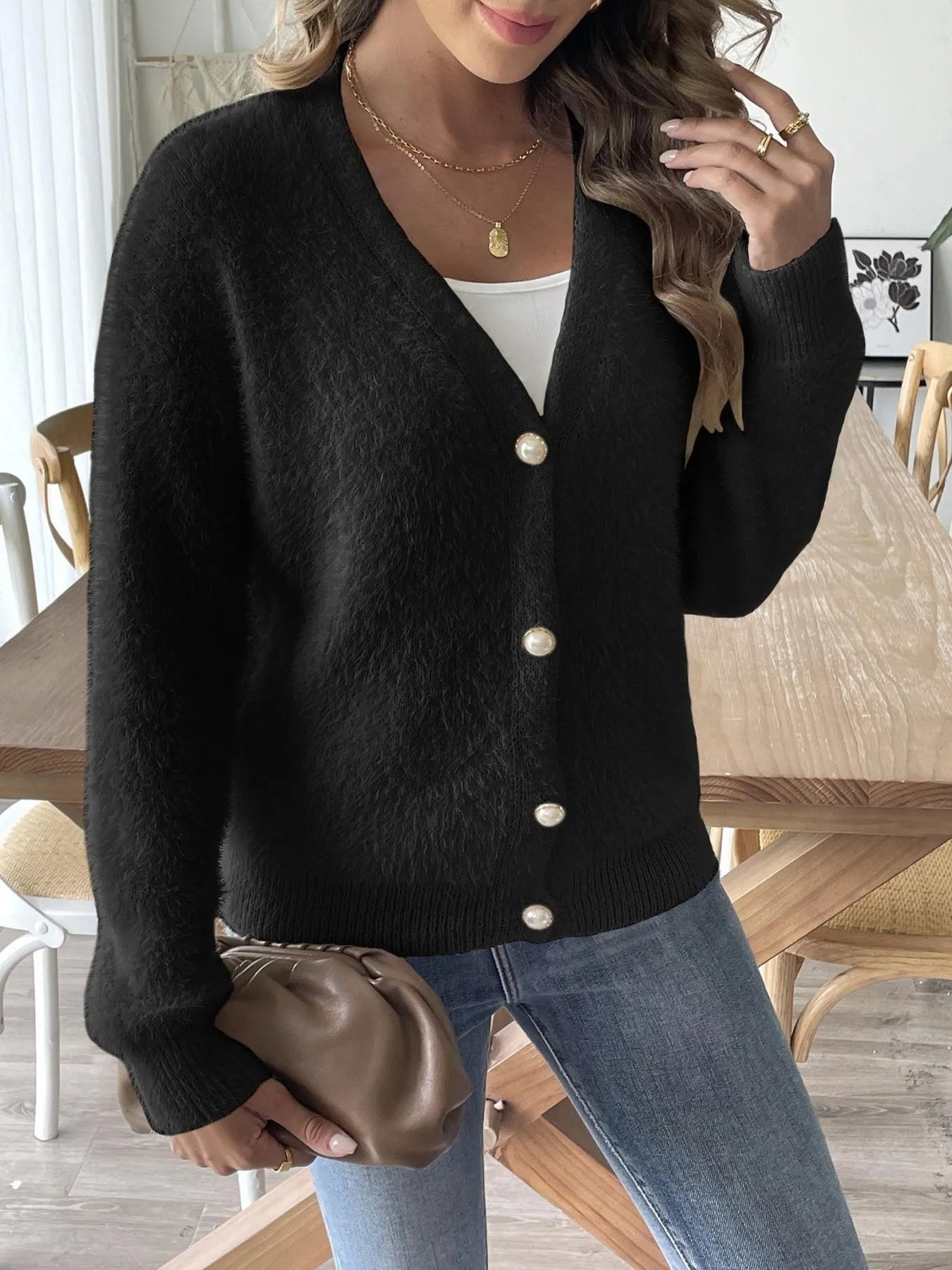 Model wearing open-front fuzzy cardigan in black – Voguelle