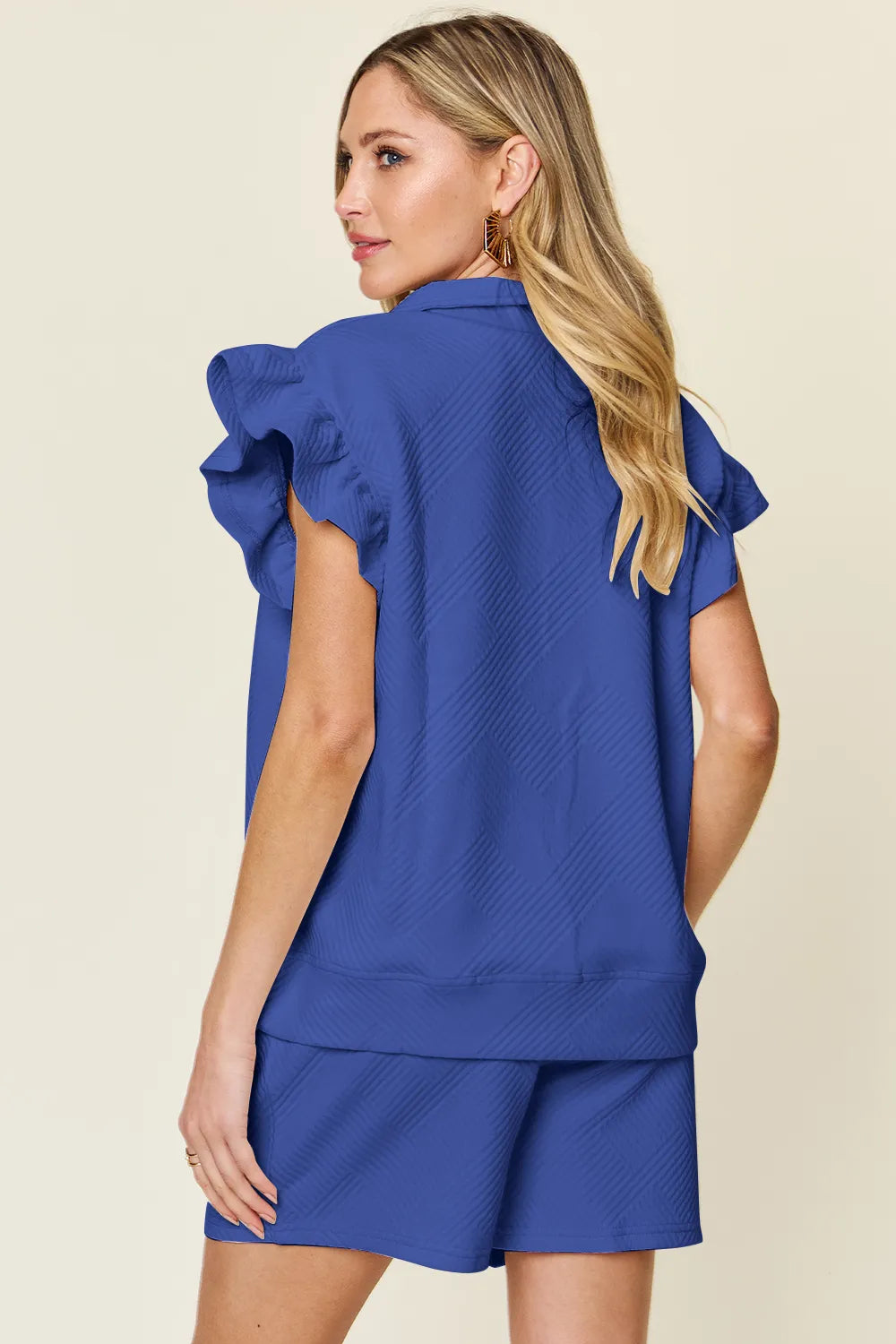 Cream flounce sleeve top tucked into drawstring shorts – Voguelle