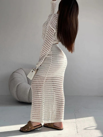 Model wearing hollow out knit maxi skirt with crop top in white – Voguelle
