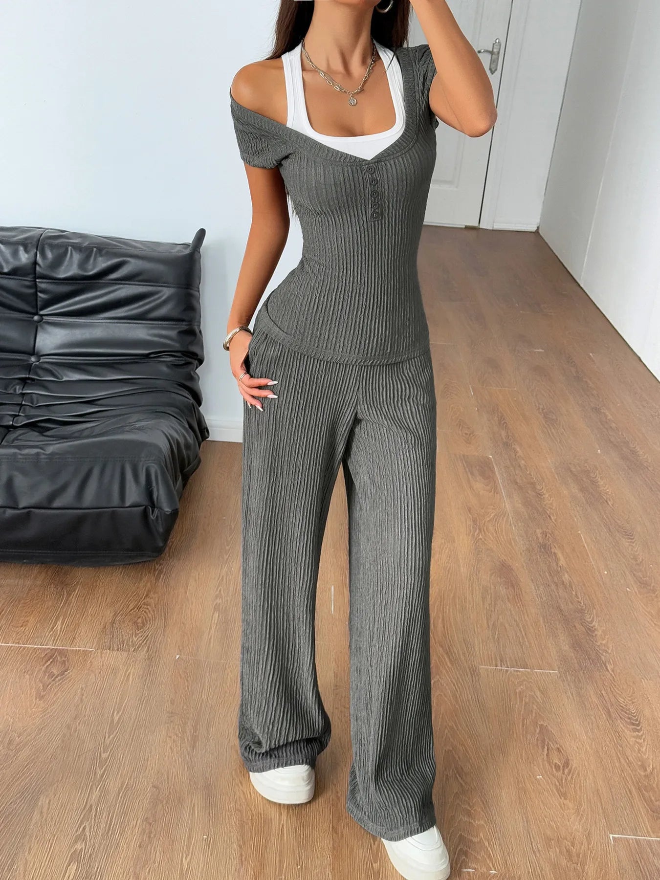 Model wearing ribbed gray short sleeve off-shoulder top and matching pants – Voguelle