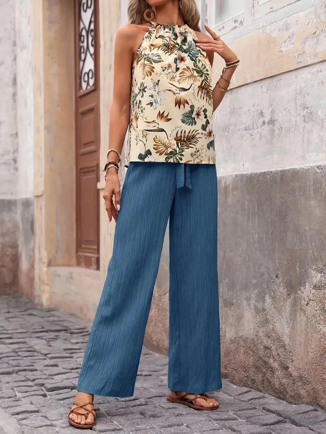 Printed floral blouse tucked into wide leg green pants – Voguelle